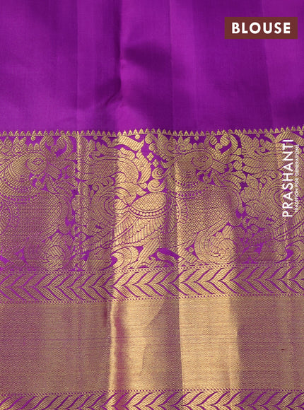 Pure kanchipuram silk saree pista green and violet with allover silver zari weaves and long annam zari woven korvai border