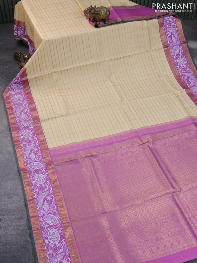 Pure kanchipuram silk saree cream and lavender shade with allover zari checked pattern and embroidery work zari border