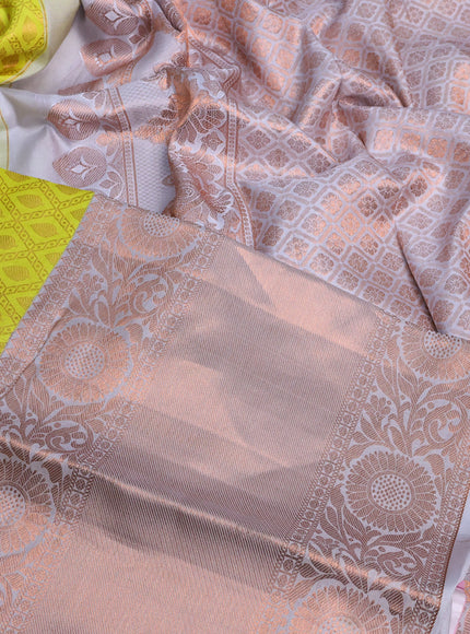 Pure kanchipuram silk saree lime yellow and pastel grey with allover zari woven brocade weaves and long copper zari woven border & embroidery work blouse