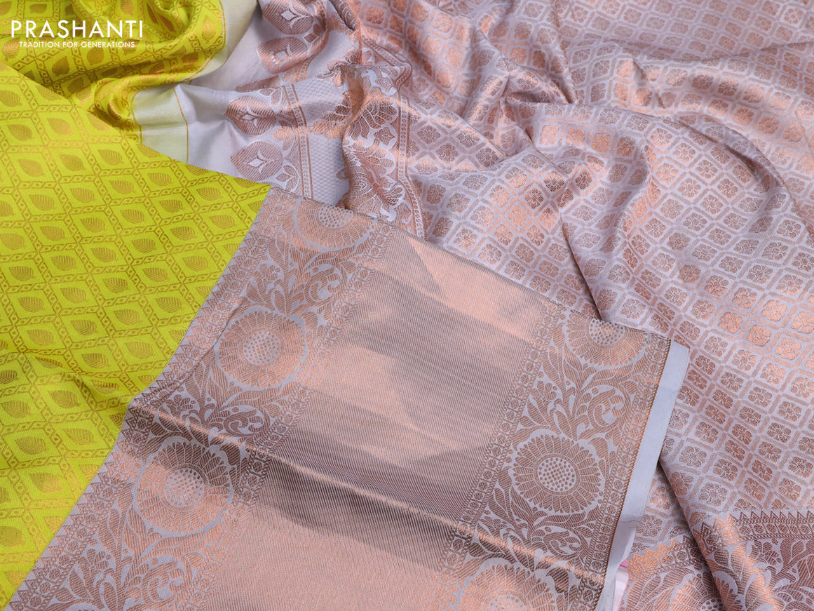 Pure kanchipuram silk saree lime yellow and pastel grey with allover zari woven brocade weaves and long copper zari woven border & embroidery work blouse