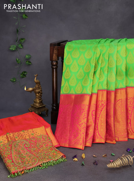 Pure kanchipuram silk saree light green and dual shade of pinkish orange with allover zari woven buttas and long zari woven border & embroidery work blouse