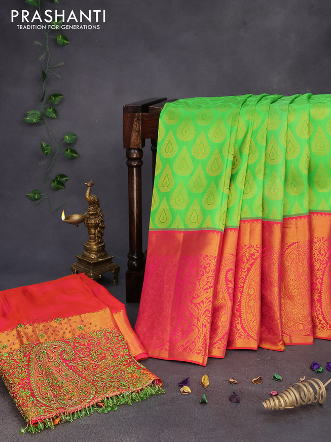 Pure kanchipuram silk saree light green and dual shade of pinkish orange with allover zari woven buttas and long zari woven border & embroidery work blouse