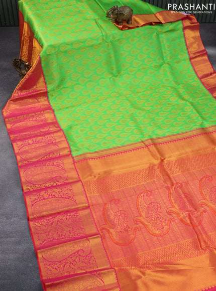 Pure kanchipuram silk saree light green and dual shade of pinkish orange with allover zari woven buttas and long zari woven border & embroidery work blouse