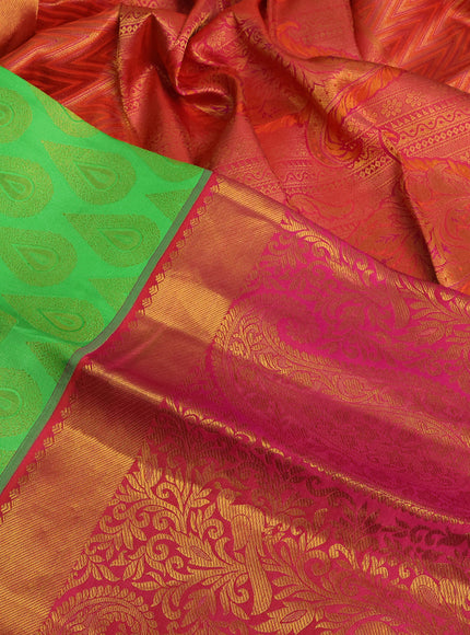 Pure kanchipuram silk saree light green and dual shade of pinkish orange with allover zari woven buttas and long zari woven border & embroidery work blouse