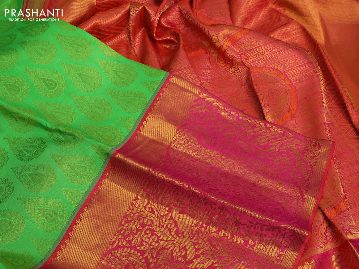 Pure kanchipuram silk saree light green and dual shade of pinkish orange with allover zari woven buttas and long zari woven border & embroidery work blouse