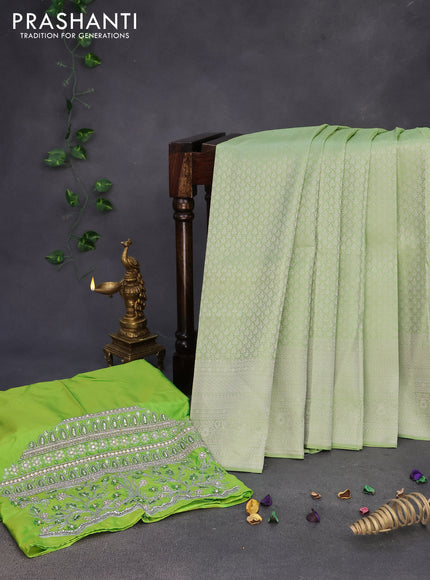 Pure kanchipuram silk saree pastel green with allover silver zari woven brocade weaves and silver zari woven border & embroidery work blouse