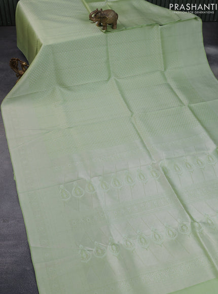 Pure kanchipuram silk saree pastel green with allover silver zari woven brocade weaves and silver zari woven border & embroidery work blouse