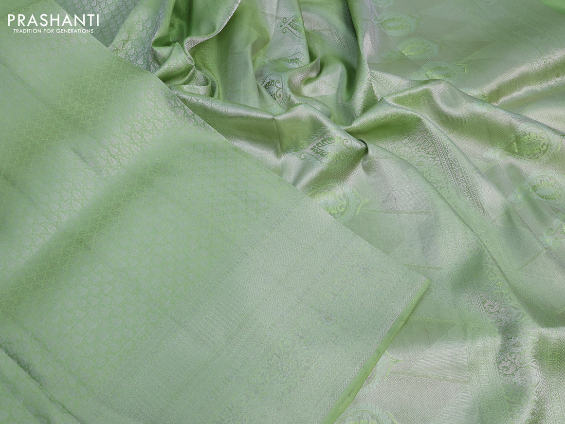 Pure kanchipuram silk saree pastel green with allover silver zari woven brocade weaves and silver zari woven border & embroidery work blouse