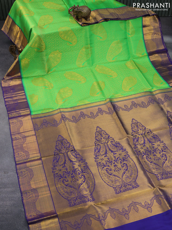 Pure kanchipuram silk saree light green and dark blue with allover zari woven brocade weaves and zari woven border & embroidery work blouse