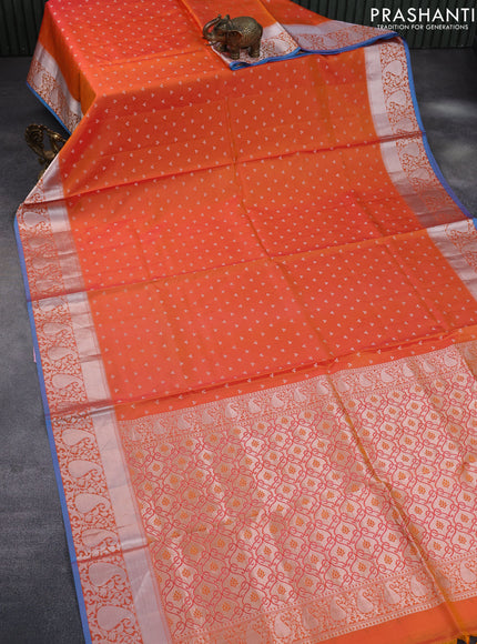 Pure kanchipuram silk saree dual shade of orange and blue with allover silver zari woven buttas and silver zari woven border & embroidery work blouse