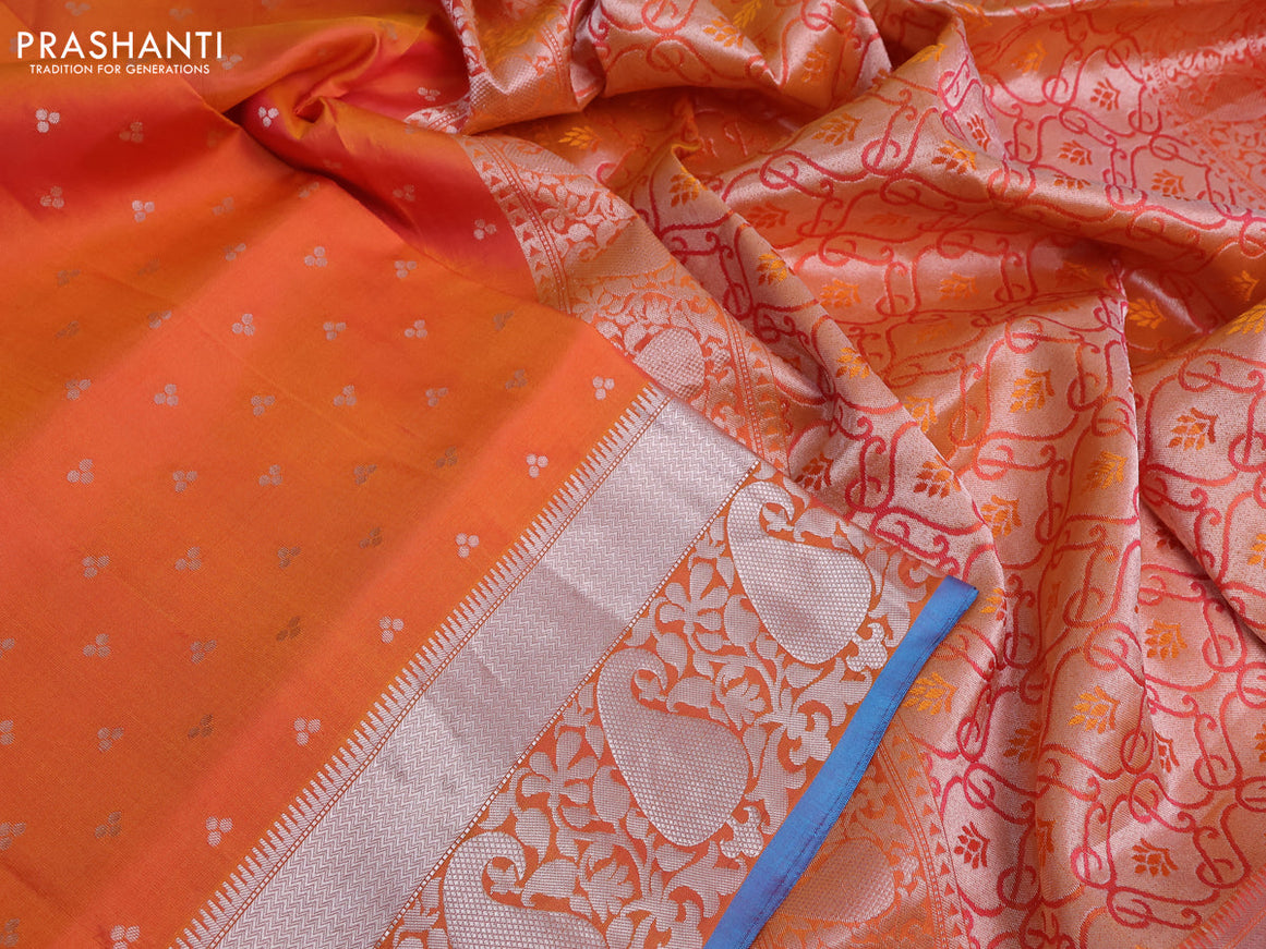 Pure kanchipuram silk saree dual shade of orange and blue with allover silver zari woven buttas and silver zari woven border & embroidery work blouse