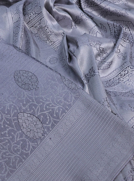 Pure kanchipuram silk saree grey with allover silver zari woven brocade weaves and silver zari woven border& embroidery work blouse