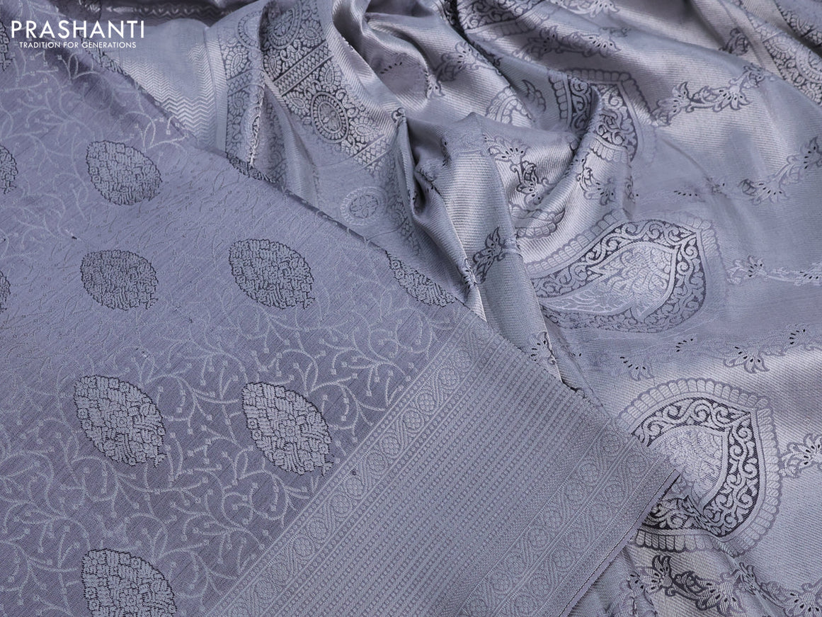 Pure kanchipuram silk saree grey with allover silver zari woven brocade weaves and silver zari woven border& embroidery work blouse