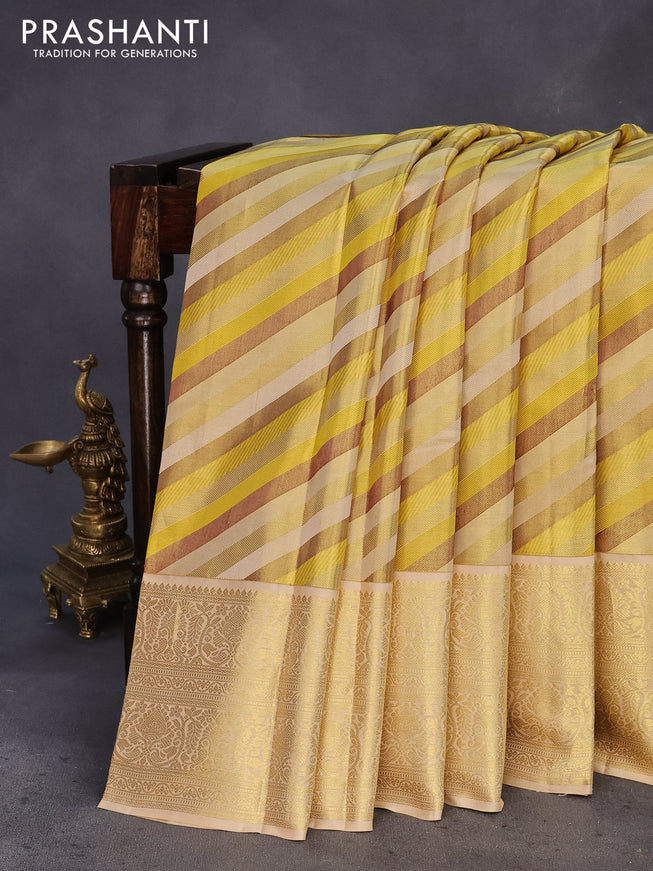 Pure kanchipuram tissue silk saree yellow and cream with allover stripes pattern and zari woven border