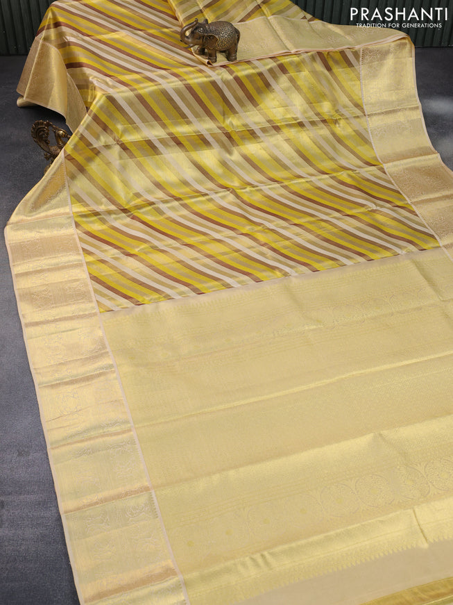 Pure kanchipuram tissue silk saree yellow and cream with allover stripes pattern and zari woven border