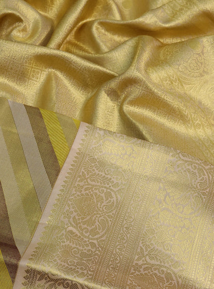 Pure kanchipuram tissue silk saree yellow and cream with allover stripes pattern and zari woven border