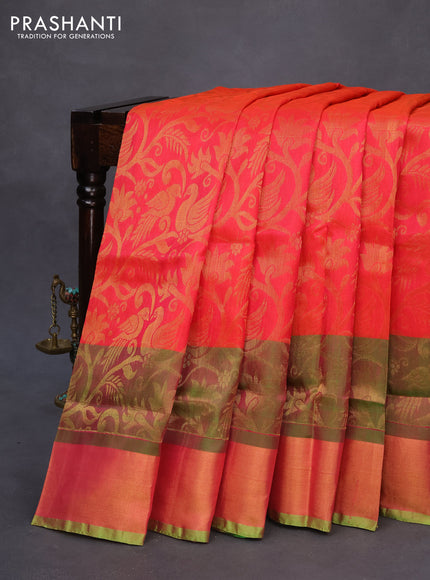 Pure uppada silk saree dual shade of pinkish orange and parrot green with allover zari woven brocade weaves and long zari woven border