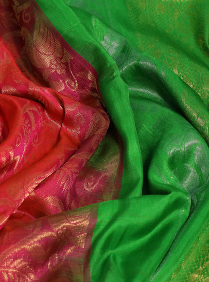 Pure uppada silk saree dual shade of pinkish orange and parrot green with allover zari woven brocade weaves and long zari woven border