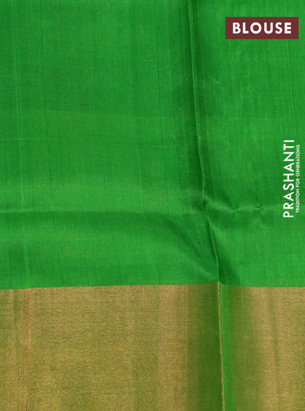 Pure uppada silk saree dual shade of pinkish orange and parrot green with allover zari woven brocade weaves and long zari woven border