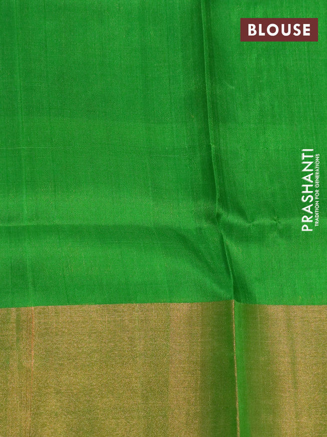 Pure uppada silk saree dual shade of pinkish orange and parrot green with allover zari woven brocade weaves and long zari woven border