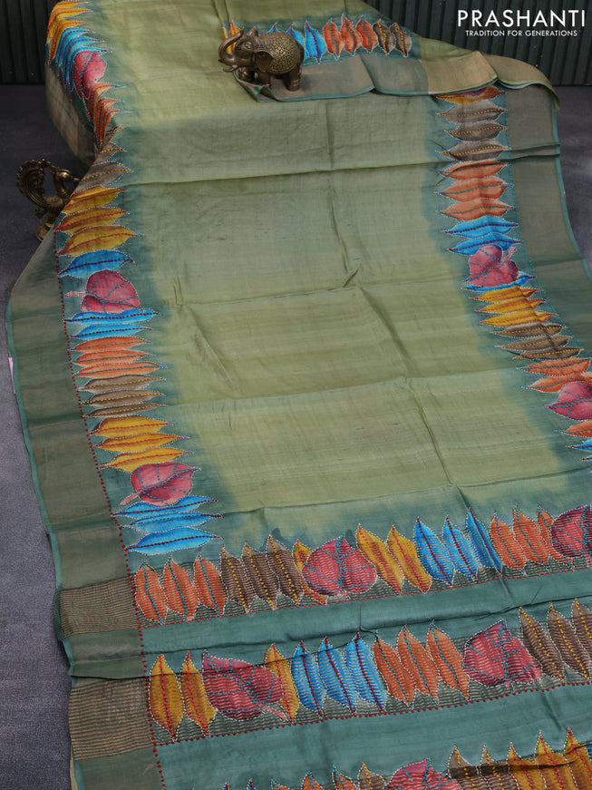 Pure tussar silk saree pastel green and pastel shade with leaf prints & french knot work and zari woven border