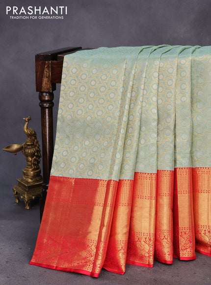 Pure kanchipuram tissue silk saree pastel blue shade and red with allover zari woven geometric weaves and long annam zari woven border