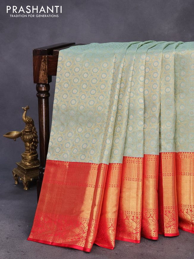 Pure kanchipuram tissue silk saree pastel blue shade and red with allover zari woven geometric weaves and long annam zari woven border