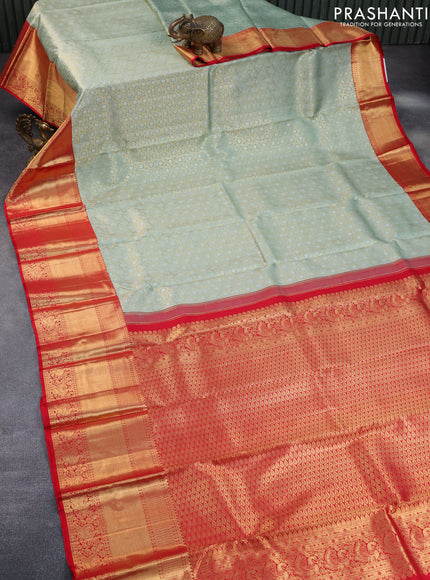 Pure kanchipuram tissue silk saree pastel blue shade and red with allover zari woven geometric weaves and long annam zari woven border