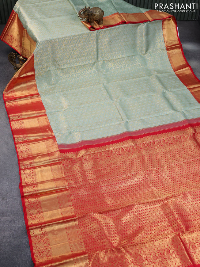 Pure kanchipuram tissue silk saree pastel blue shade and red with allover zari woven geometric weaves and long annam zari woven border