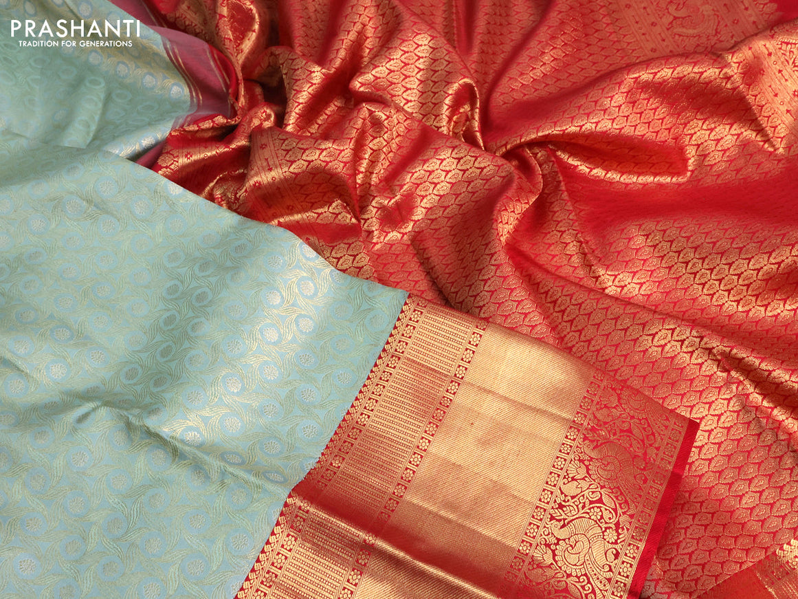 Pure kanchipuram tissue silk saree pastel blue shade and red with allover zari woven geometric weaves and long annam zari woven border