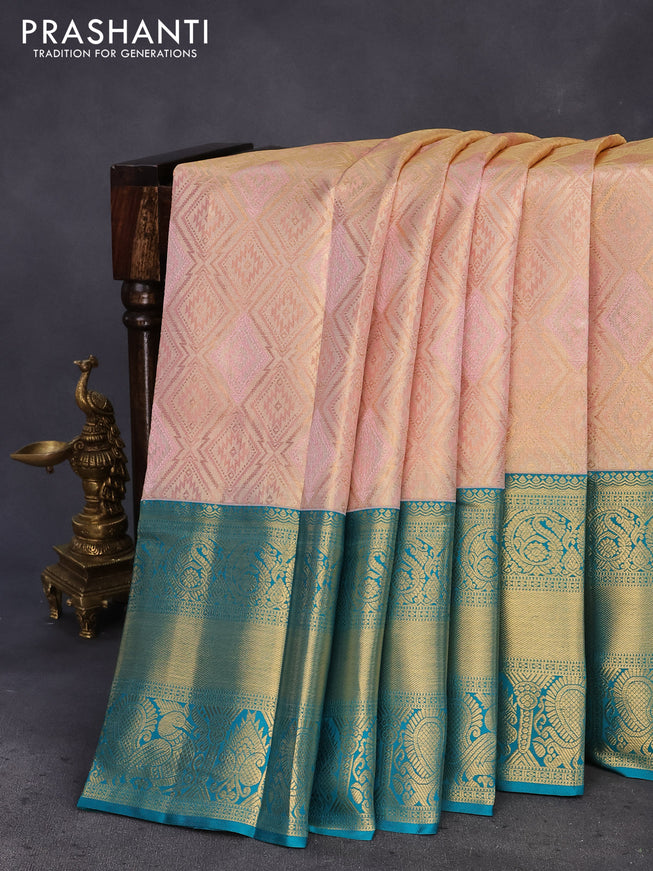 Pure kanchipuram tissue silk saree dual shade of peach pink and teal blue with allover zari woven geometric weaves and long annam zari woven border