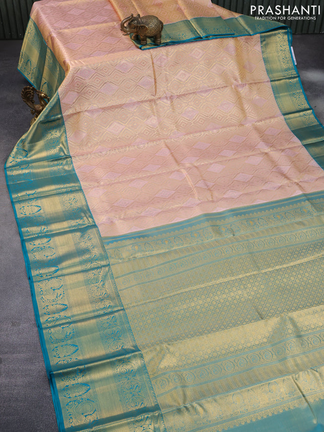 Pure kanchipuram tissue silk saree dual shade of peach pink and teal blue with allover zari woven geometric weaves and long annam zari woven border