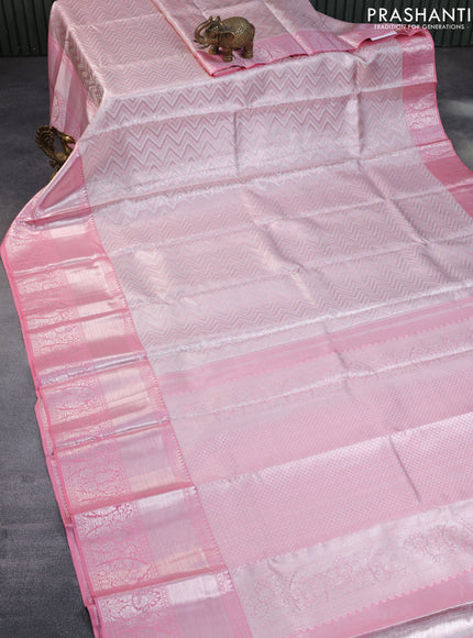 Pure kanchipuram tissue silk saree light pink with allover silver zari woven geometric weaves and long silver zari woven border