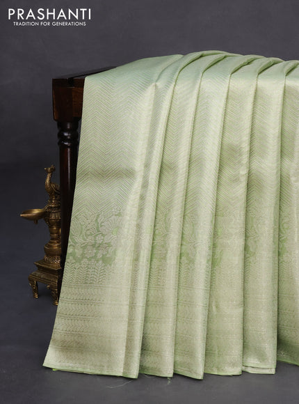 Pure kanchipuram tissue silk saree pista green with allover silver zari weaves and long silver zari woven border