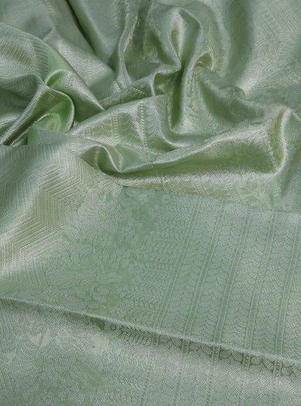 Pure kanchipuram tissue silk saree pista green with allover silver zari weaves and long silver zari woven border