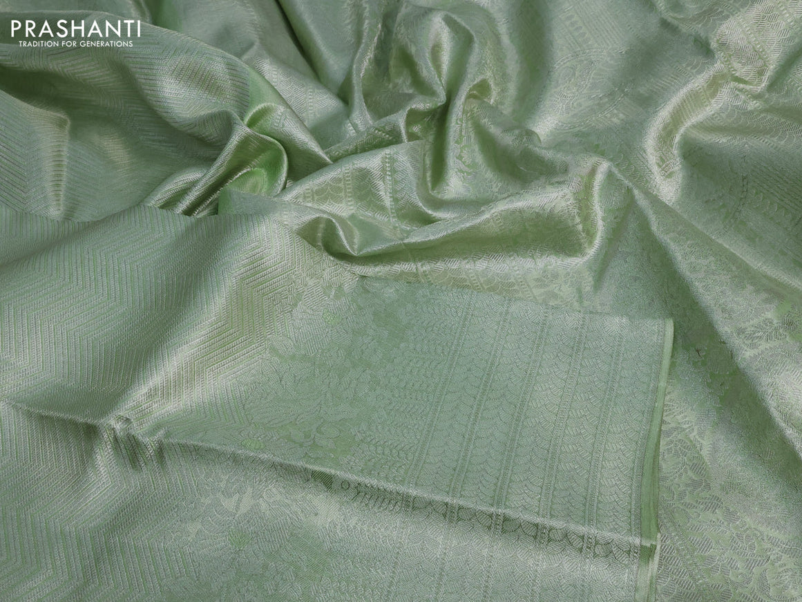 Pure kanchipuram tissue silk saree pista green with allover silver zari weaves and long silver zari woven border