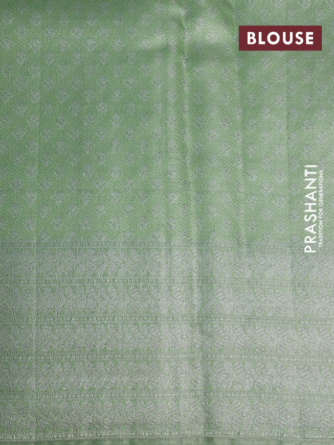 Pure kanchipuram tissue silk saree pista green with allover silver zari weaves and long silver zari woven border