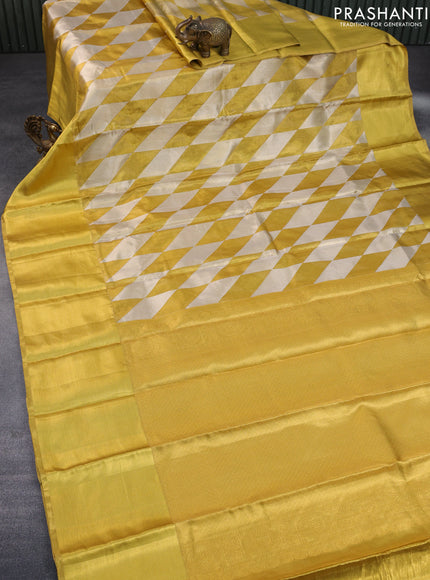 Pure kanchipuram tissue silk saree gold with allover zari woven geometric weaves and long zari woven border