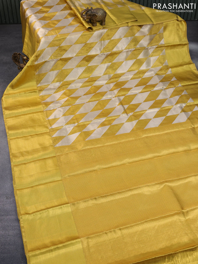 Pure kanchipuram tissue silk saree gold with allover zari woven geometric weaves and long zari woven border