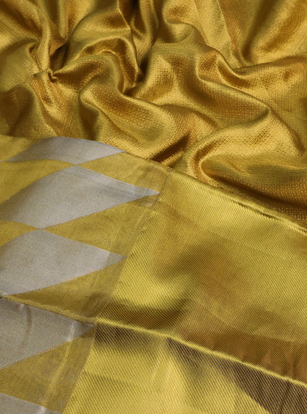 Pure kanchipuram tissue silk saree gold with allover zari woven geometric weaves and long zari woven border