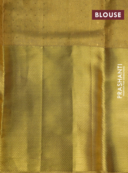 Pure kanchipuram tissue silk saree gold with allover zari woven geometric weaves and long zari woven border