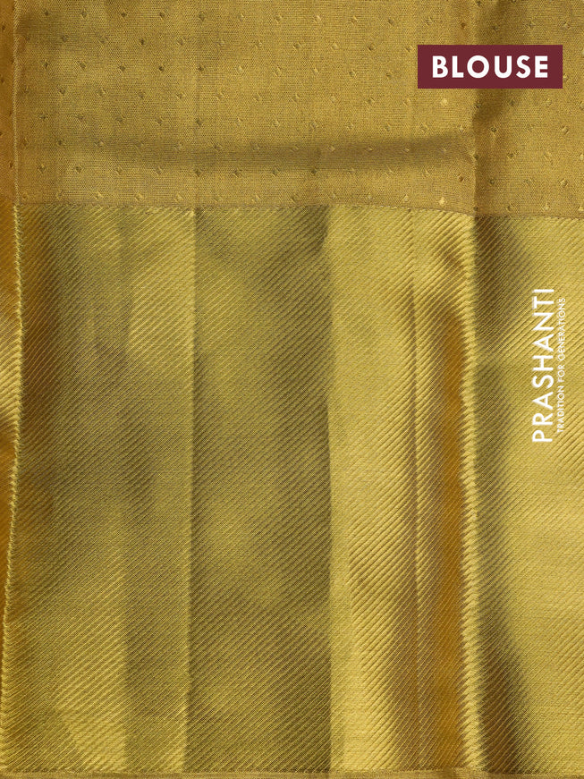 Pure kanchipuram tissue silk saree gold with allover zari woven geometric weaves and long zari woven border