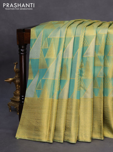 Pure kanchipuram tissue silk saree dual shade of teal blue with allover zari woven geometric weaves and zari woven border