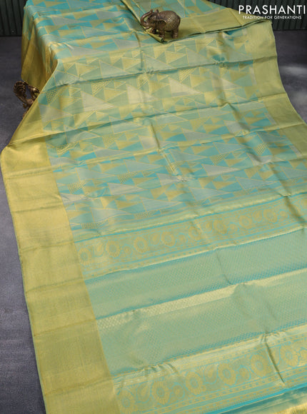 Pure kanchipuram tissue silk saree dual shade of teal blue with allover zari woven geometric weaves and zari woven border