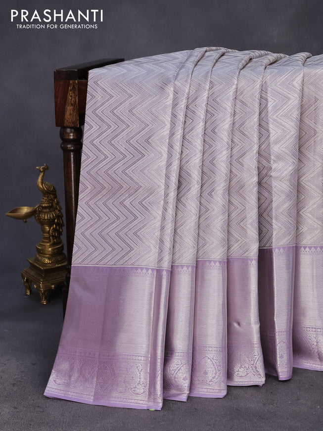 Pure kanchipuram tissue silk saree pastel grey and mild lavender shade with allover silver zari woven weaves and silver zari woven border