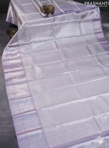 Pure kanchipuram tissue silk saree pastel grey and mild lavender shade with allover silver zari woven weaves and silver zari woven border