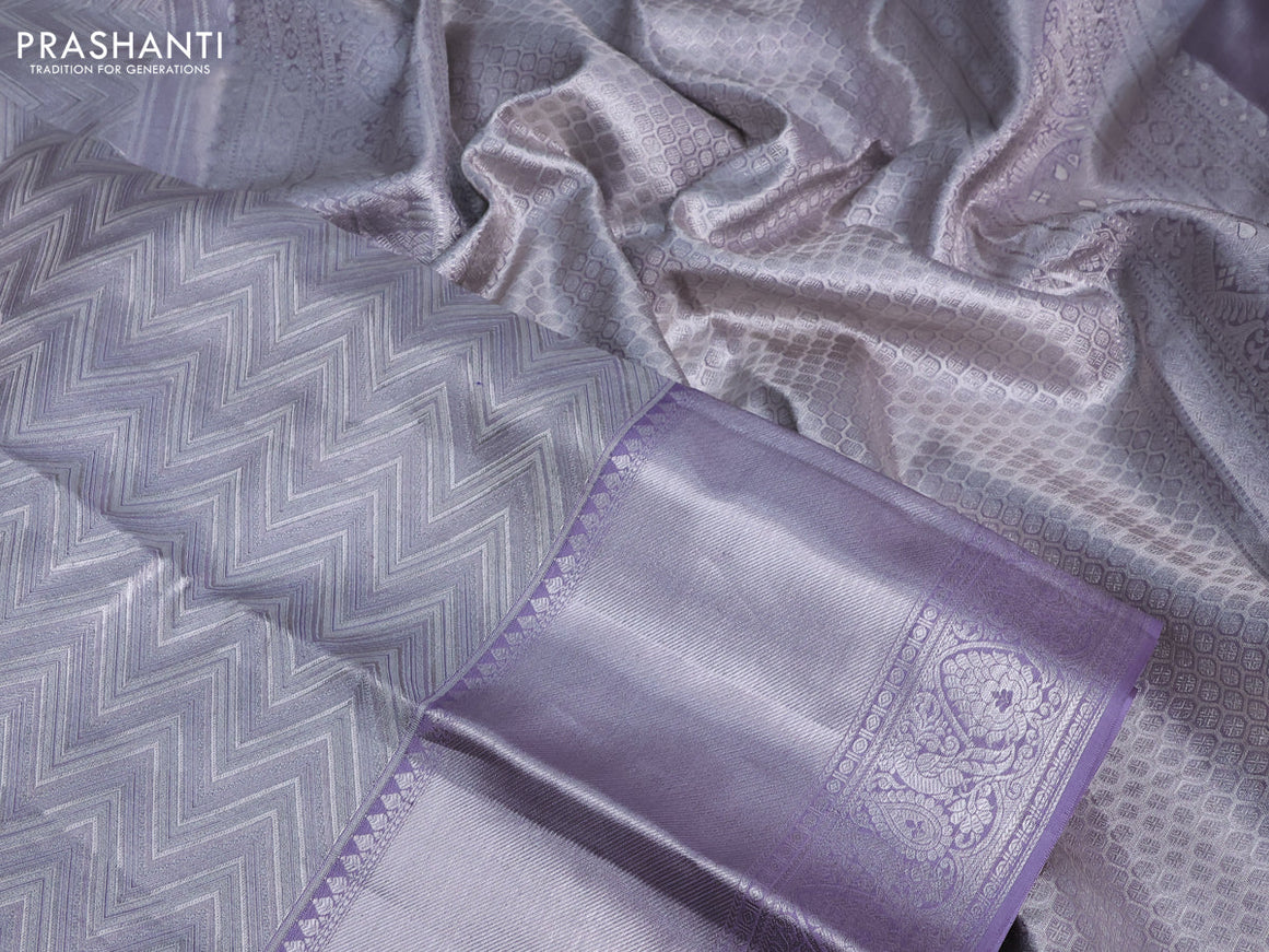 Pure kanchipuram tissue silk saree pastel grey and mild lavender shade with allover silver zari woven weaves and silver zari woven border