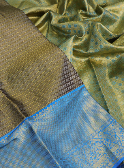 Pure kanchipuram tissue silk saree dual shade of blackish gold and cs blue with allover zari weaves and zari woven border