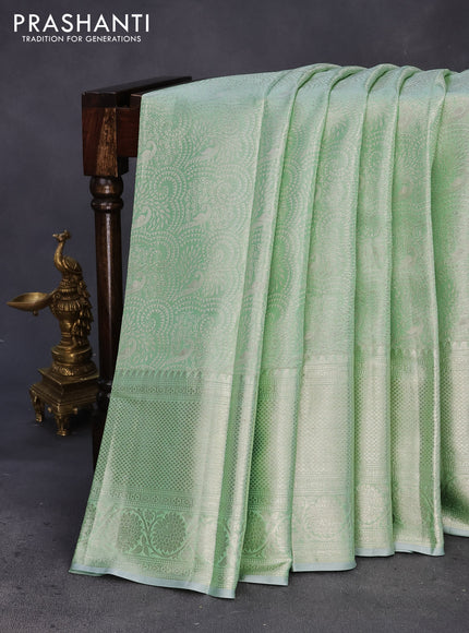 Pure kanchipuram tissue silk saree pastel green with allover silver zari woven brocade weaves and silver zari woven border