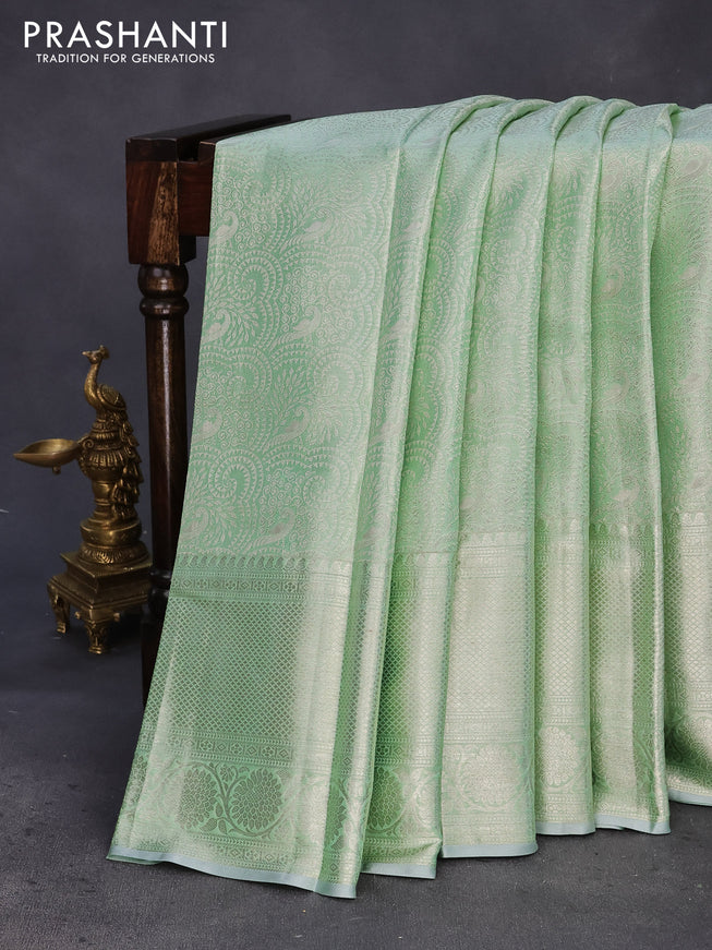 Pure kanchipuram tissue silk saree pastel green with allover silver zari woven brocade weaves and silver zari woven border